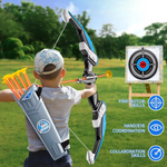 Kid aiming the LED light-up bow at the target outdoors